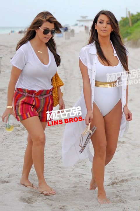 Kim Kardashian没有受到男友Kanye West录影带影响来到海滩录制节目 (照片)