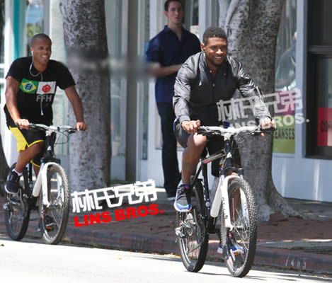 Usher骑自行车锻炼，脱把!!骑车，车上摆出打拳姿势 (4张照片)