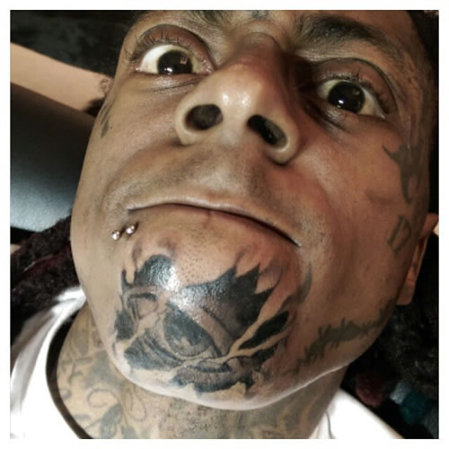 够硬!!! Lil Wayne展示疯狂的新纹身..位于下巴..他需要第3只眼睛..光明会?? (3张照片)