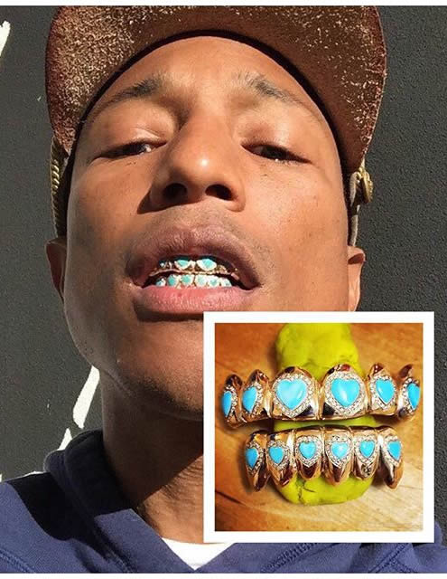 停不下来了..Pharrell再展示新牙套..黄金钻石蓝心宝石 (照片)