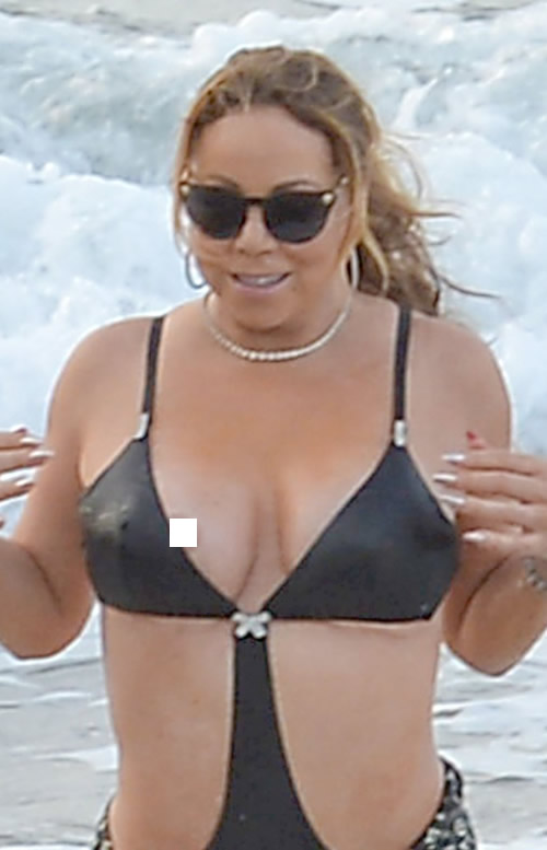 尴尬了!! 好身材Mariah Carey在海滩走光 (照片)